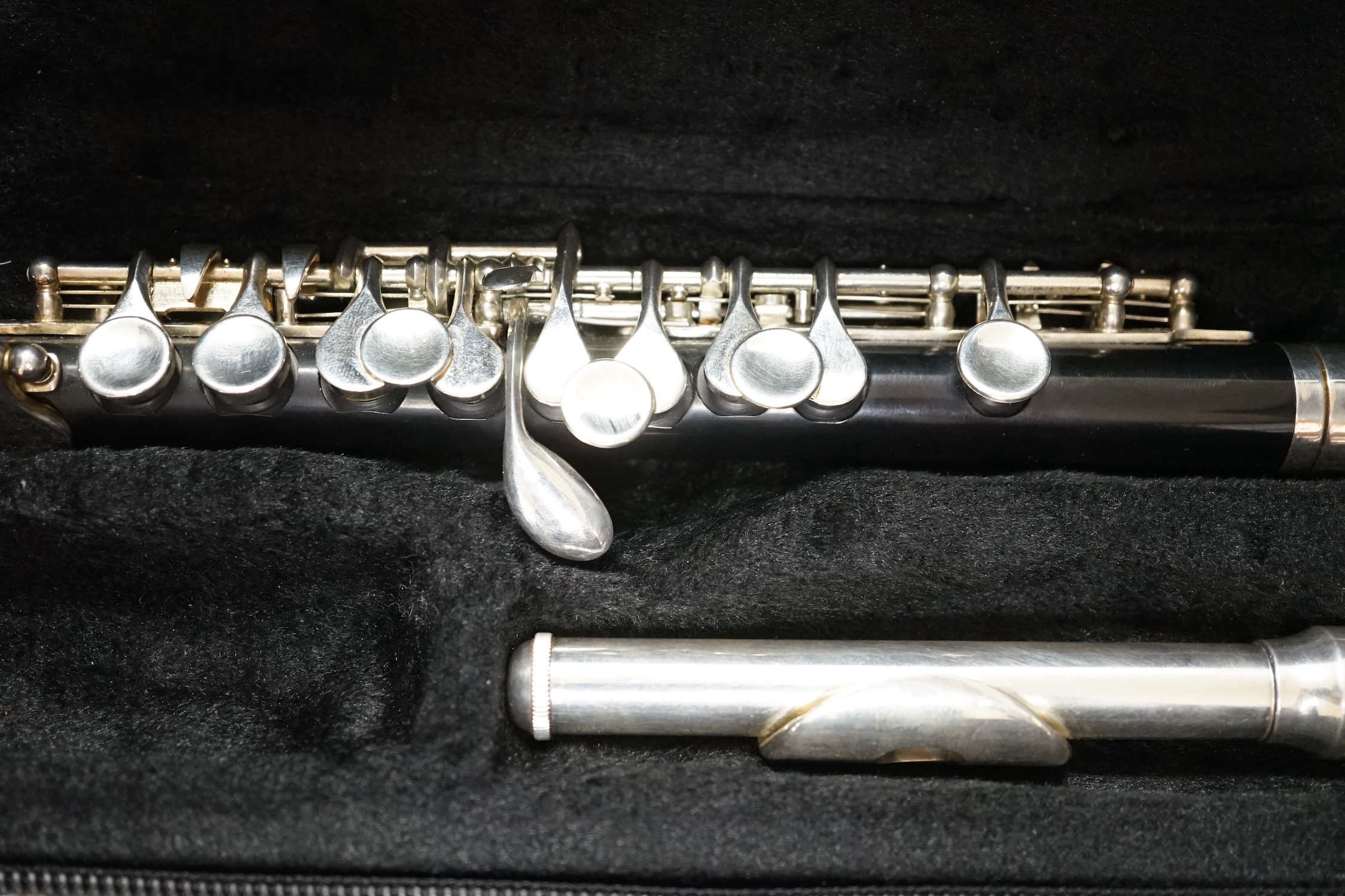 A cased Trevor James student’s piccolo, P1